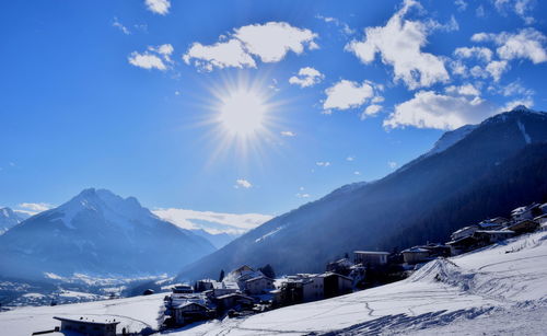 Scenic view of snowcapped mountains against sky