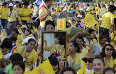 Crowd protesting on street in city