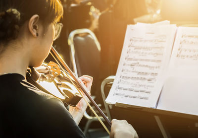 Close-up of man playing the piano