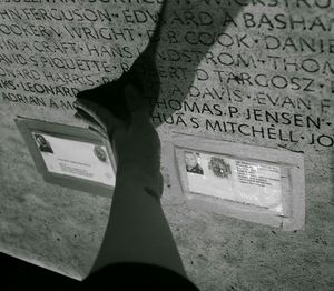 Close-up of woman standing on wall