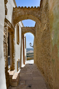 A narrow street among the old houses of irsina in basilicata, region in southern italy.