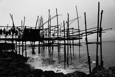 Pier over sea against sky