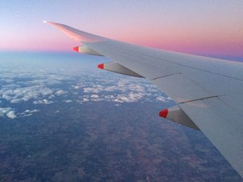 Cropped image of airplane flying in sky