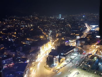 High angle view of illuminated cityscape at night