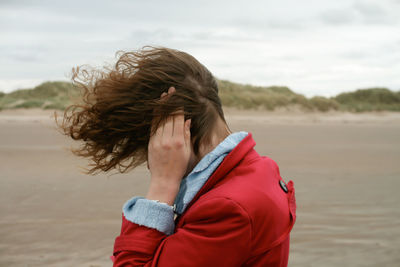 Woman standing at beach