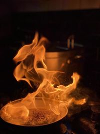 Close-up of fire in darkroom