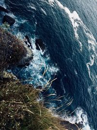 High angle view of water flowing through rocks