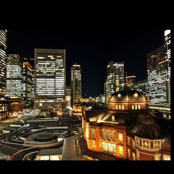 Illuminated buildings in city at night