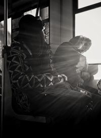 Woman seen through window