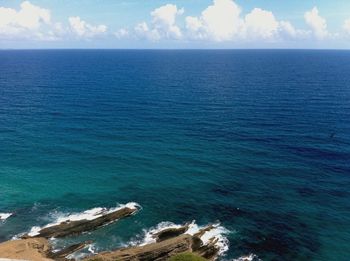 Scenic view of sea against cloudy sky