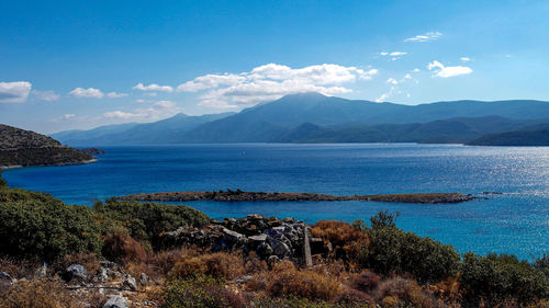 Scenic view of sea against blue sky