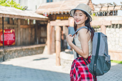 Young woman standing outdoors