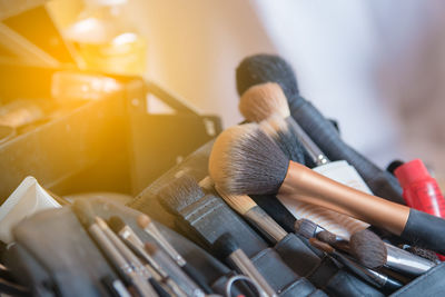 Close-up of make-up brushes on table