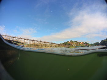 View of calm sea with town in background