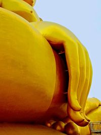 Low angle view of yellow fruit against sky