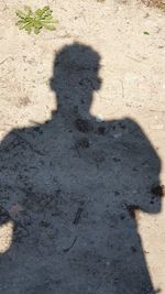 Shadow of man on field