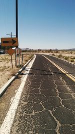 Empty road against clear sky