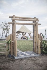 Built structure on field against sky