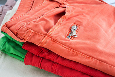 High angle view of multi colored jeans on table