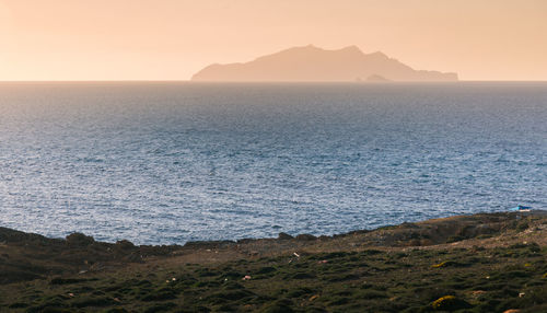 Scenic view of sea against clear sky during sunset