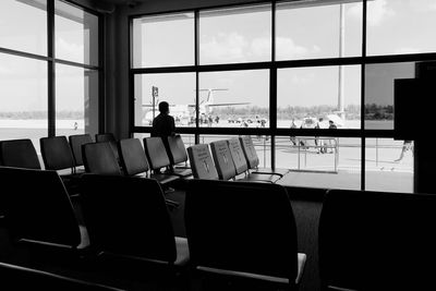 Man sitting on chair at airport