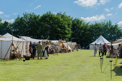 People on field against sky