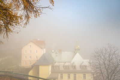 Buildings against sky during winter