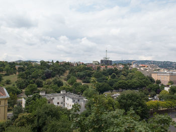 High angle view of townscape and trees against sky