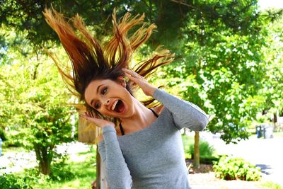 Portrait of funny young woman outdoors