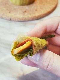 Close-up of hand holding apple