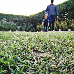 Full length of woman walking on field