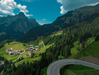 High angle view of townscape and mountains against sky