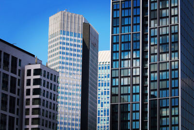 Low angle view of modern buildings against clear sky