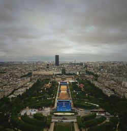 High angle view of cityscape against cloudy sky