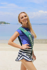 Portrait of a smiling young woman on beach