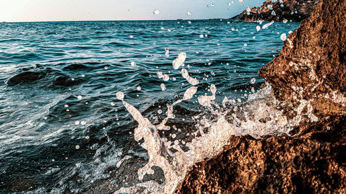 Sea waves splashing on rocks