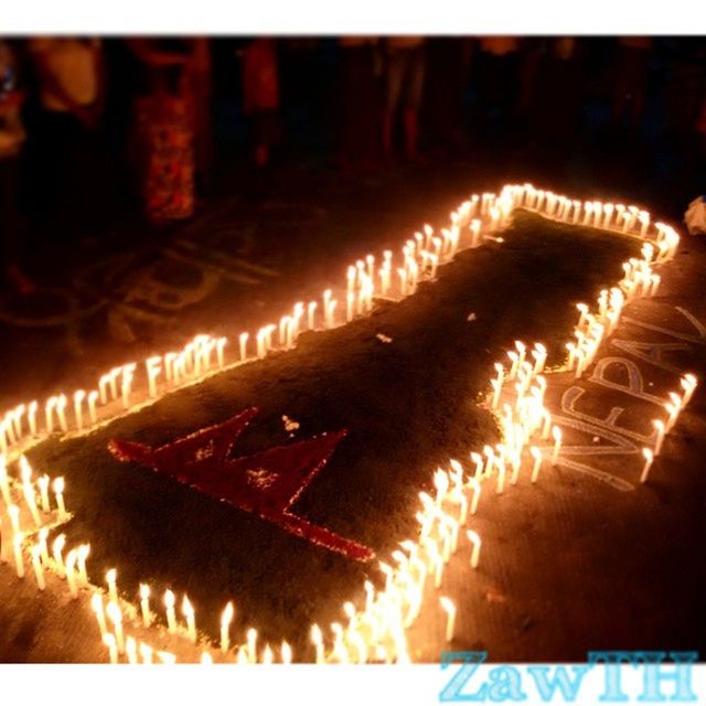 illuminated, indoors, night, close-up, flame, glowing, burning, fire - natural phenomenon, high angle view, heat - temperature, focus on foreground, no people, candle, selective focus, auto post production filter, light - natural phenomenon, lighting equipment, red, tradition, part of