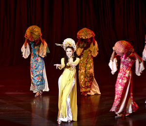 Group of people standing in traditional clothing