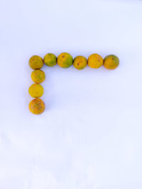 High angle view of fruits against white background