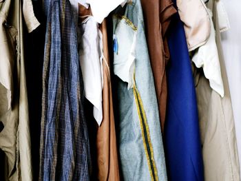 Close-up of clothes hanging on rack in store