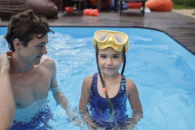 Portrait of smiling girl in swimming pool