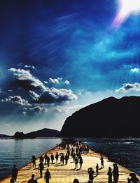 Silhouette of people enjoying at sea