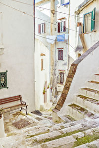 View of alley amidst buildings