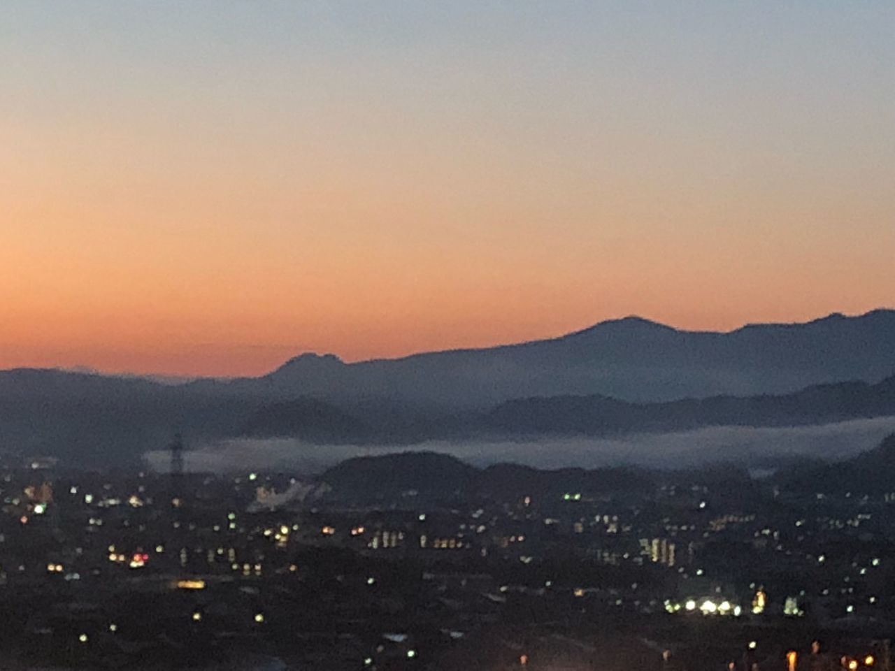 SCENIC VIEW OF SILHOUETTE MOUNTAINS AGAINST ROMANTIC SKY