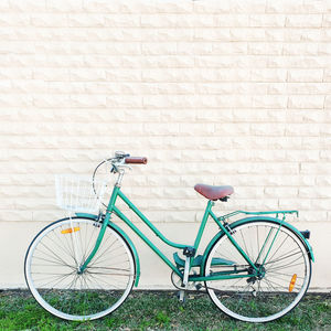 Bicycle parked against wall