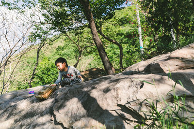 Man sitting on rock
