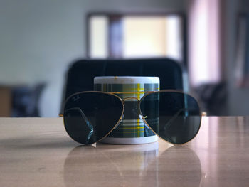 Close-up of sunglasses on table