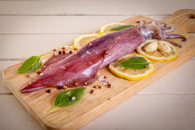 High angle view of meat on cutting board