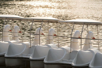 Empty chairs by sea