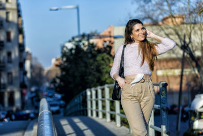 Smiling woman standing in city